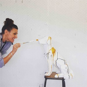 Artist Anna Stichbury painting her ceramic dog for the Chinese New Year, Year of the Dog charity auction