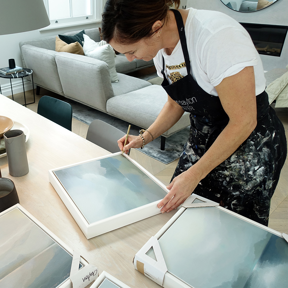 Greer Clayton signing her Beyond Fiordland Subantartic series paintings