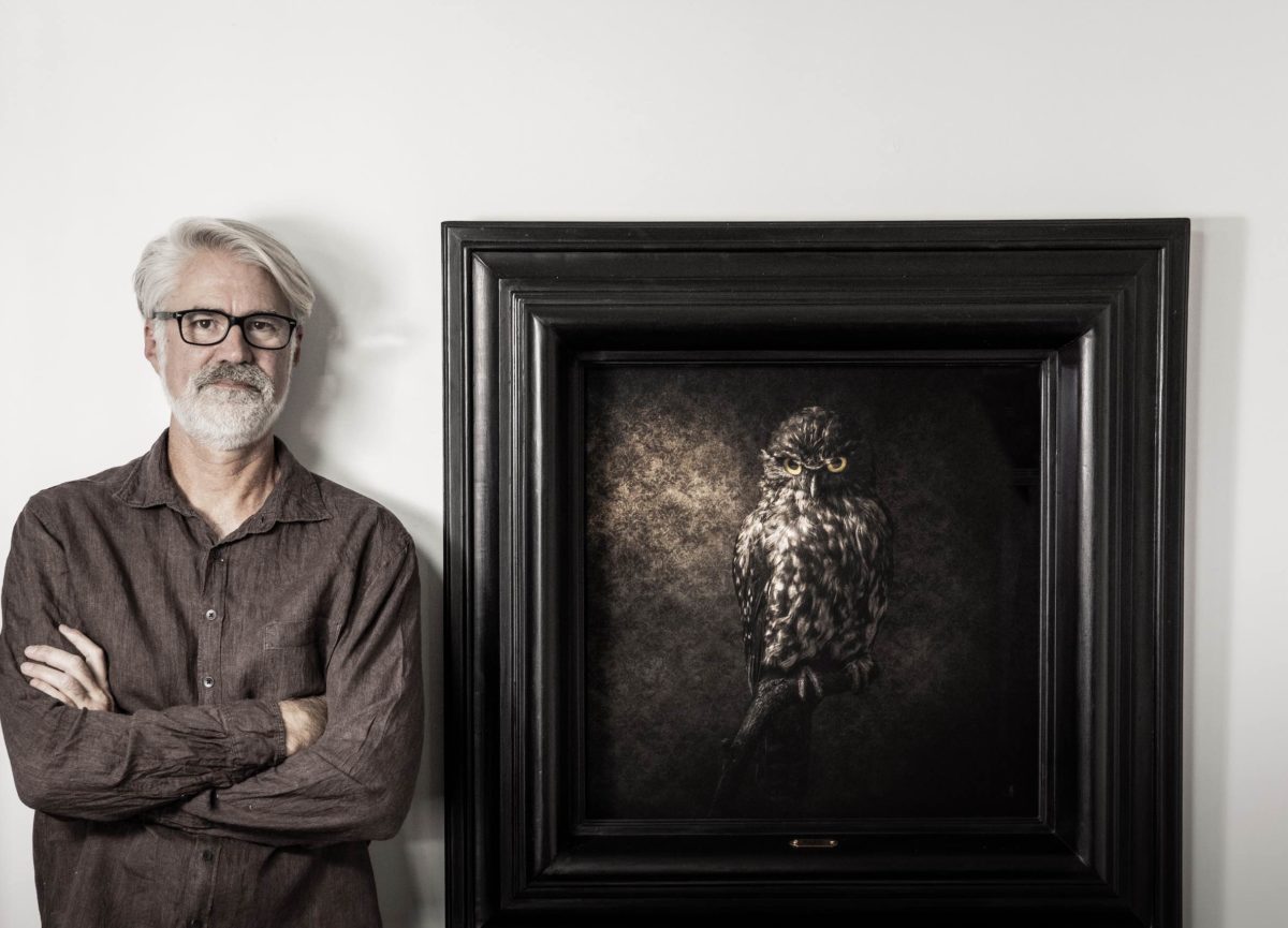 Artist Jae Frew with his Ruru photograph bird portrait Parnell Gallery Auckland NZ