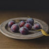Plums on Metal Plate
